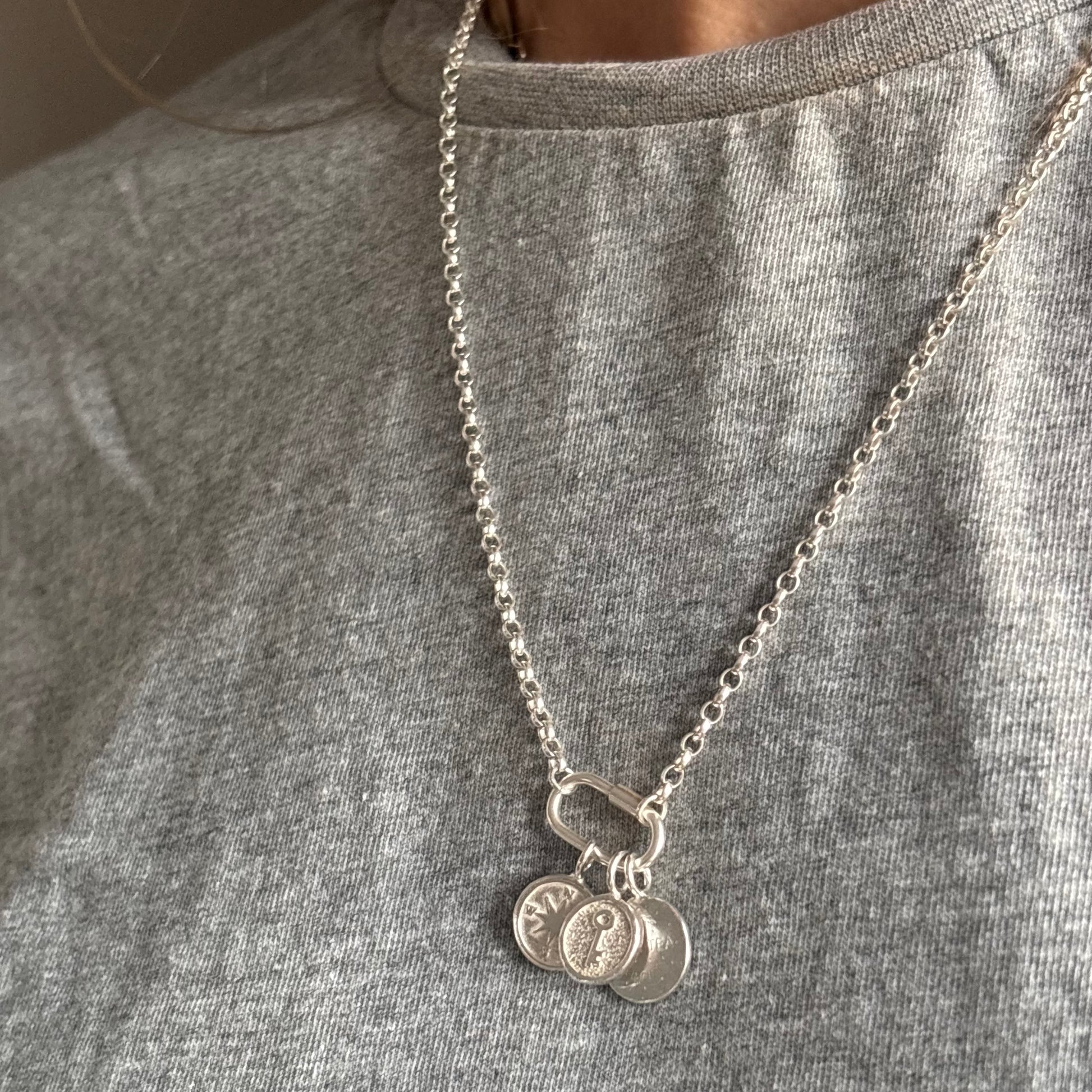 Sterling silver charm necklace with central connector