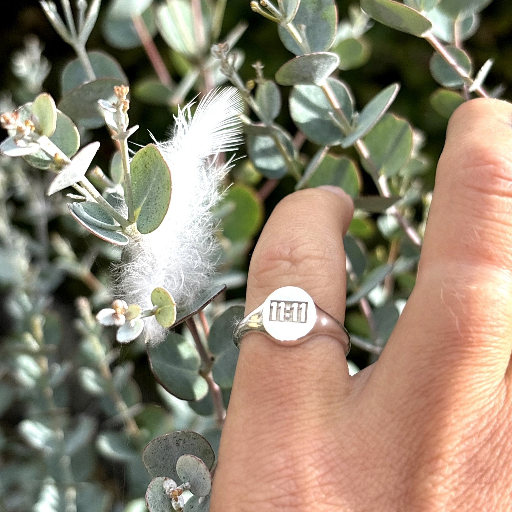 11:11 engraved on a oval sterling silver signet ring 