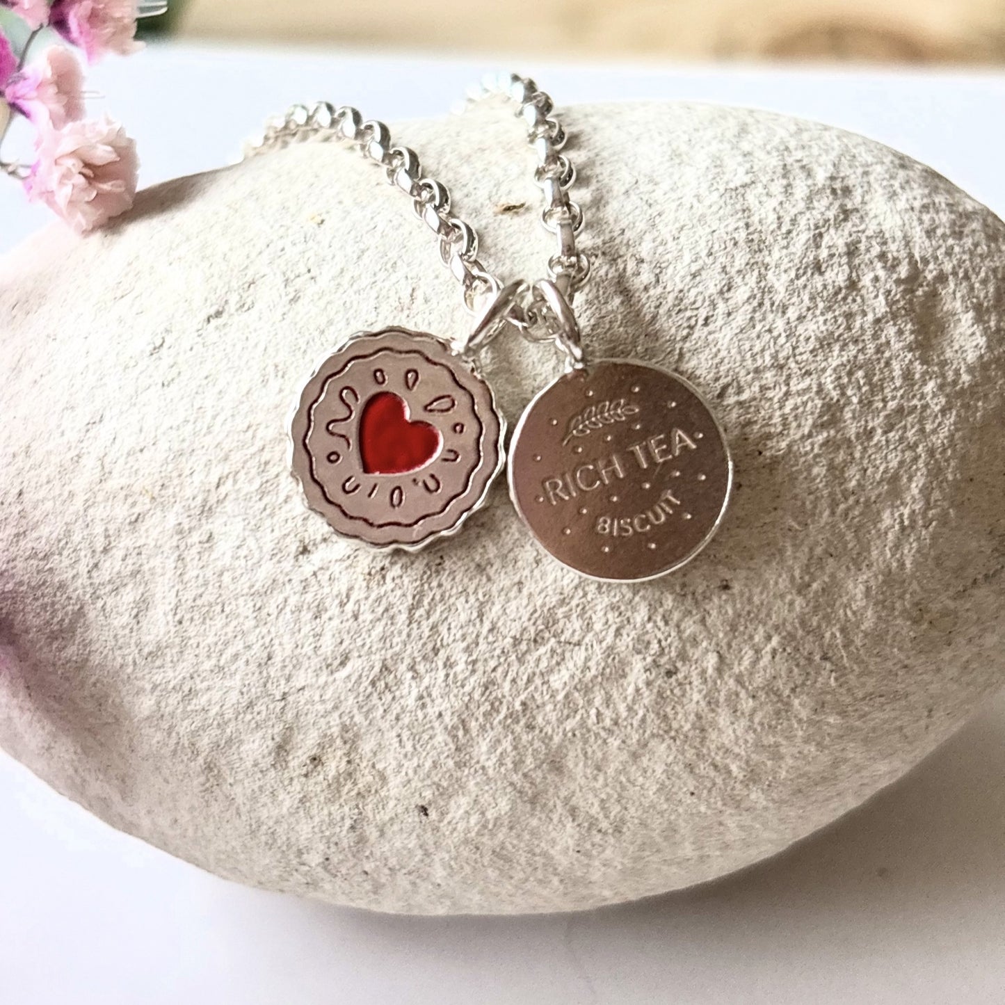 Silver necklace with a silver jammy dodger charm and a silver rich tea biscuit charm