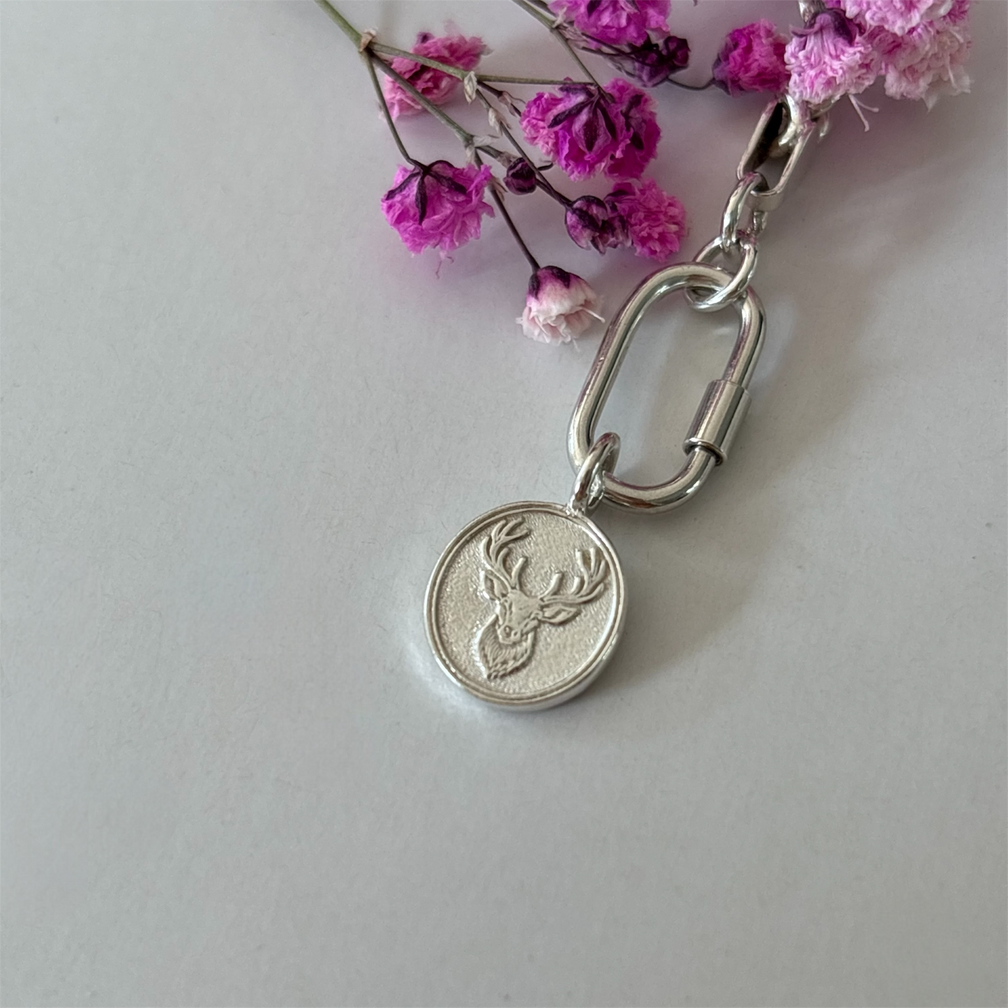 Silver Charm with 3d engraved stag surrounded by flowers