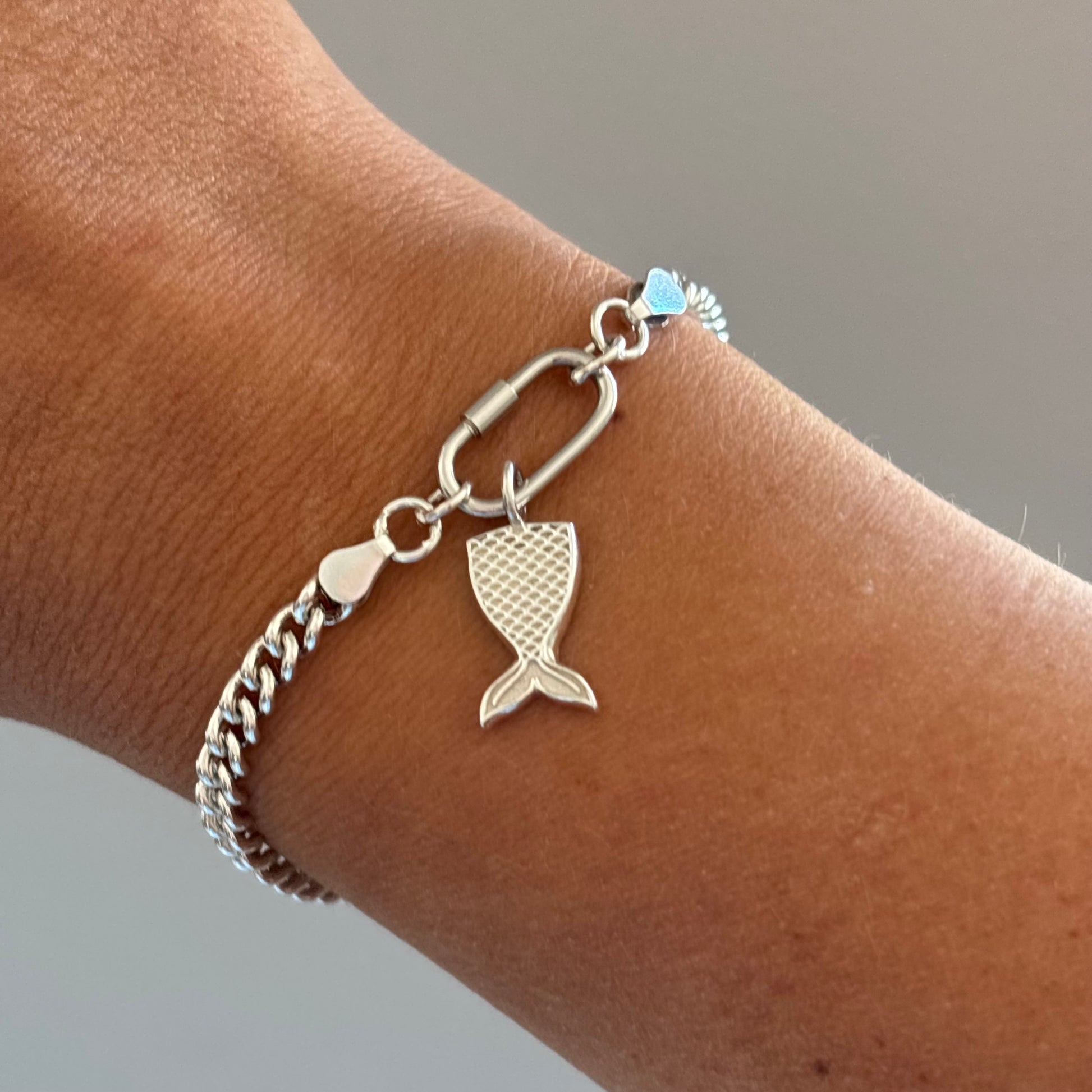 Sterling silver curb chain bracelet with a carabiner clasp and a silver mermaid tail
Charm
