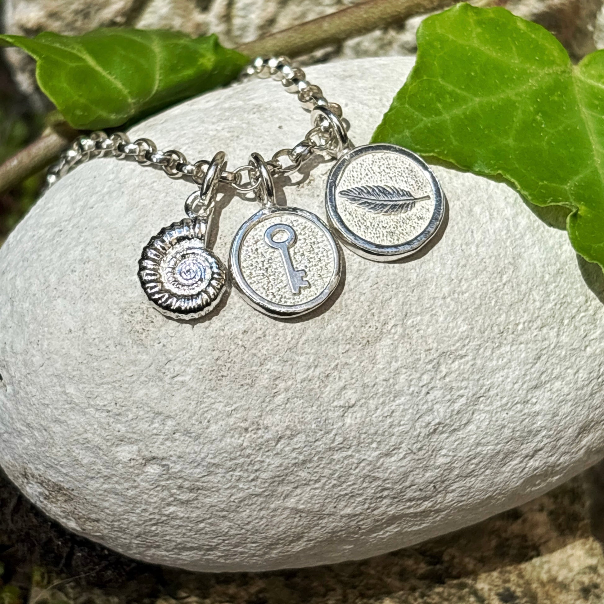 Sterling Silver keyCharm, feather charm and fossil charm Necklace – Keepsake Jewellery