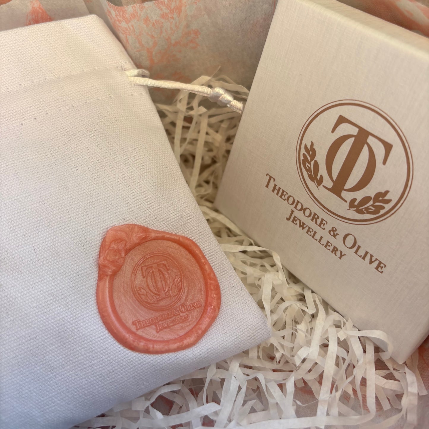 Theodore & Olive Jewellery packaging with branded jewellery box and cotton pouch sealed with wax seal