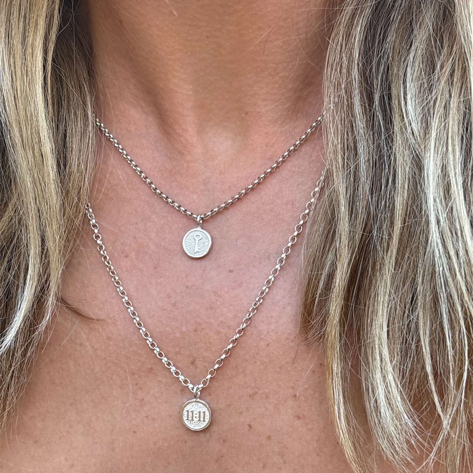 Sterling silver key charm necklace and a sterling silver 11:11 necklace 