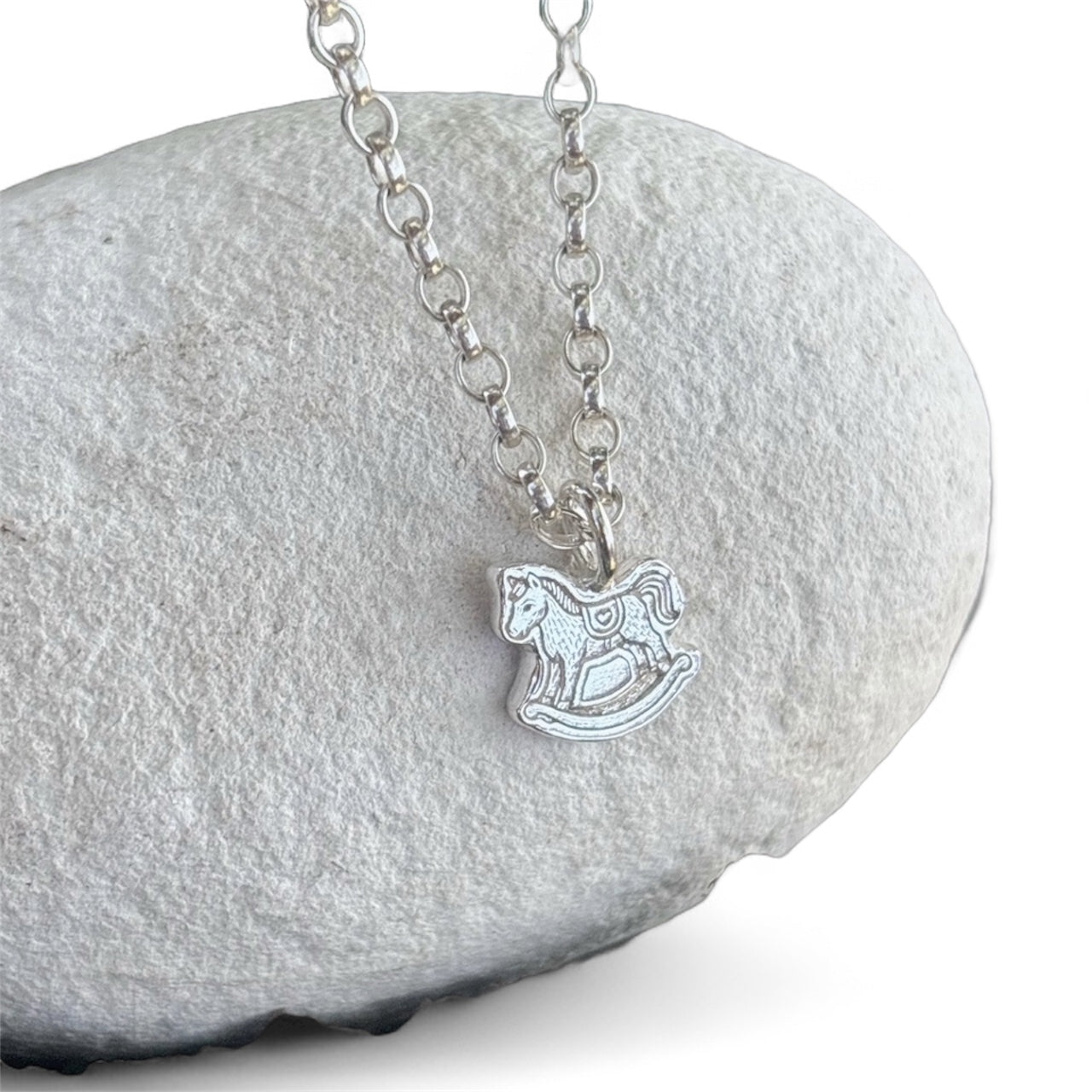 Silver belcher chain with a silver rocking horse pendant 