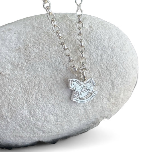 Silver belcher chain with a silver rocking horse pendant 