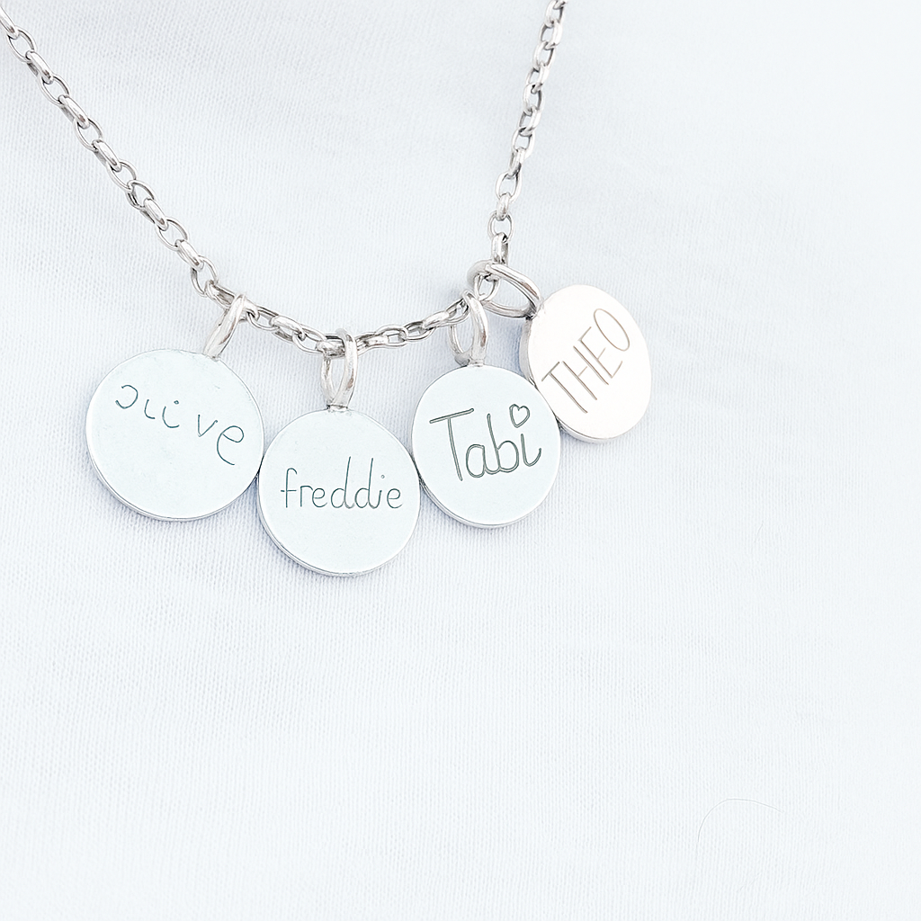 Sterling silver pendant engraved with child’s handwriting