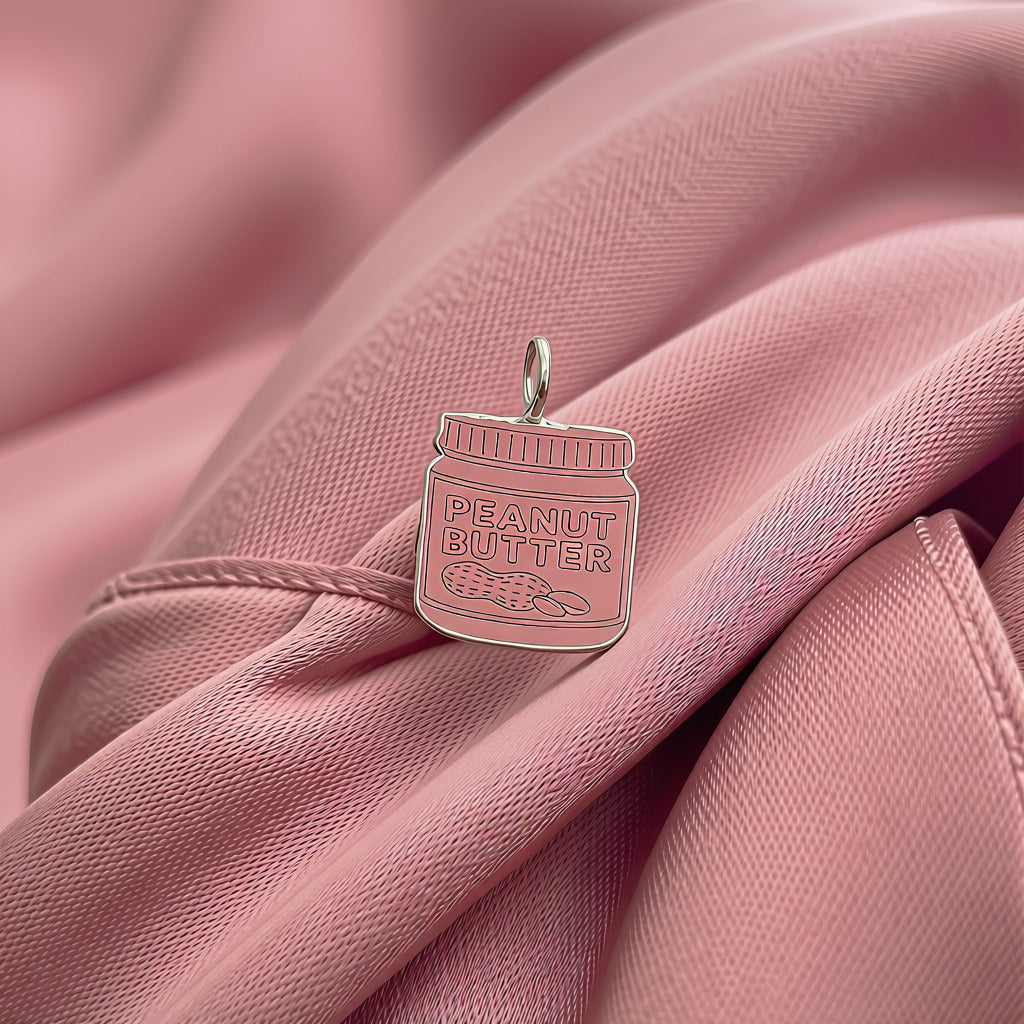 Sterling Silver Peanut butter jar on dusky pink satin